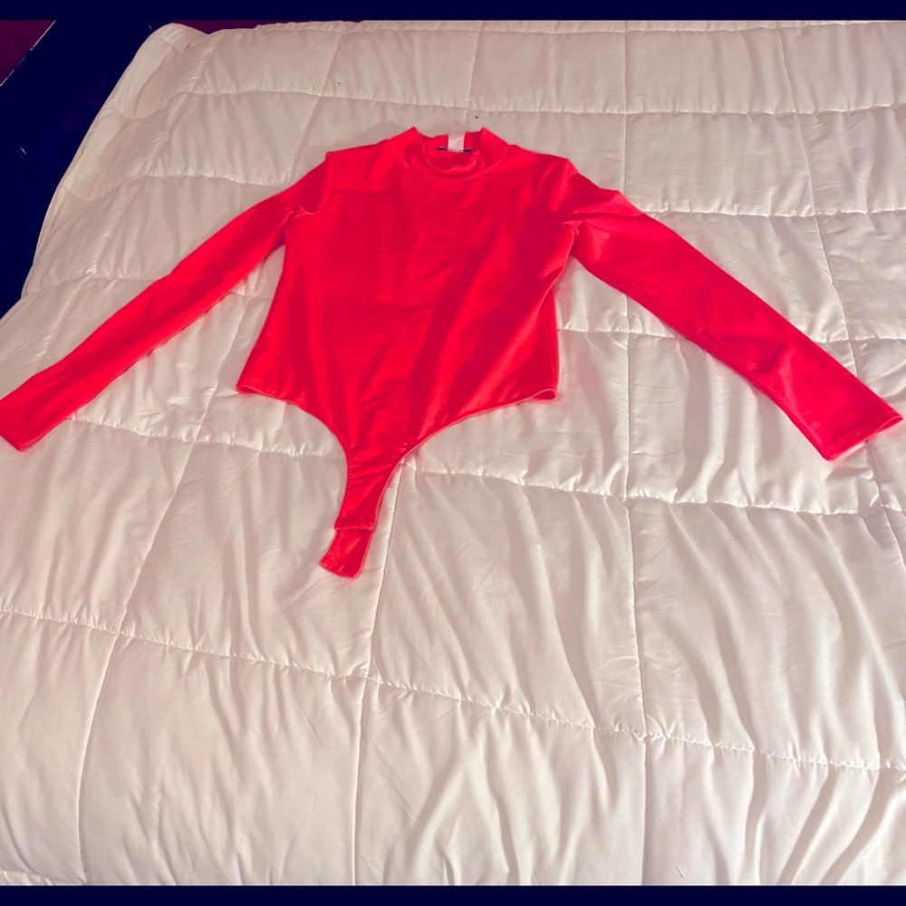 NWOT Discovery orange bodysuit B3-7